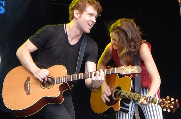 Sarah Zimmerman and Justin Davis playing together on stage